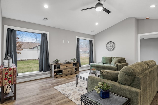 living room featuring light wood-type flooring, ceiling fan, and lofted ceiling