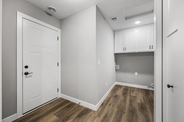 washroom featuring a textured ceiling and dark hardwood / wood-style floors