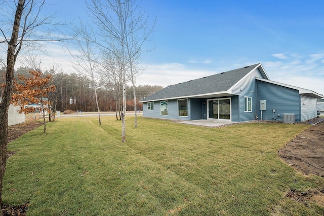 exterior space with a yard, a patio, and central AC unit