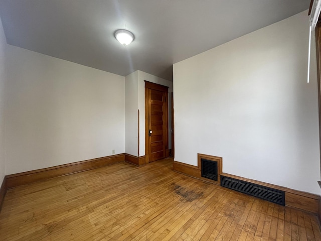 unfurnished room with light hardwood / wood-style floors