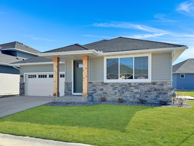 view of front facade with a garage and a front lawn