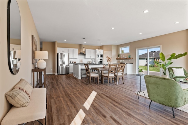 dining area featuring dark hardwood / wood-style flooring and sink