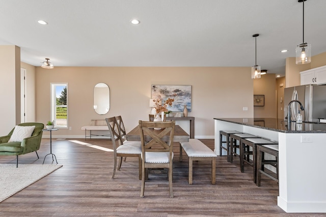 dining area featuring dark wood-type flooring