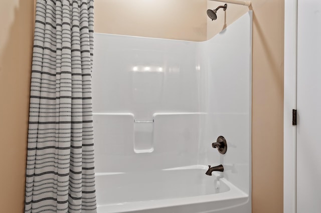 bathroom with shower / bath combo