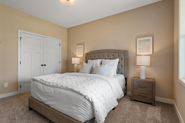 bedroom featuring light colored carpet and a closet