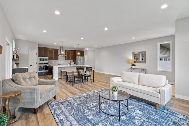 1242 Willowbrook Cir, Delano, MN 55328 - living room featuring recessed lighting and light wood-style flooring