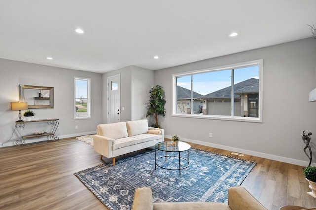 living room with light hardwood / wood-style flooring