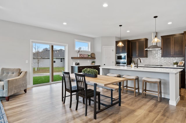 1242 Willowbrook Cir, Delano, MN 55328 - dining area with light wood-style flooring and recessed lighting