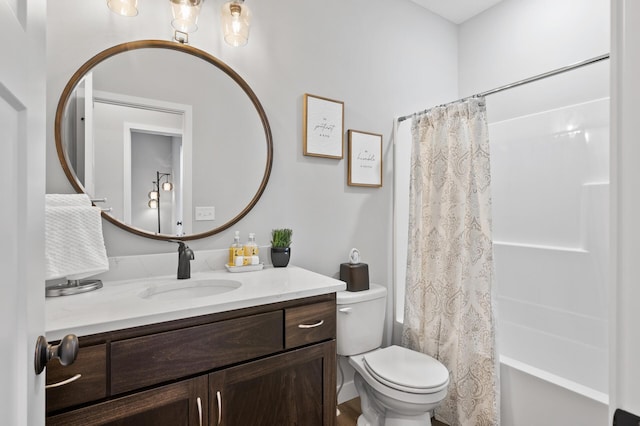 full bathroom with vanity, toilet, and shower / bath combo with shower curtain