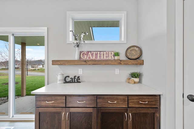 bar with dark brown cabinetry