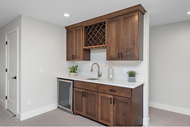 bar with sink and beverage cooler