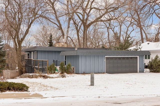 view of snow covered garage