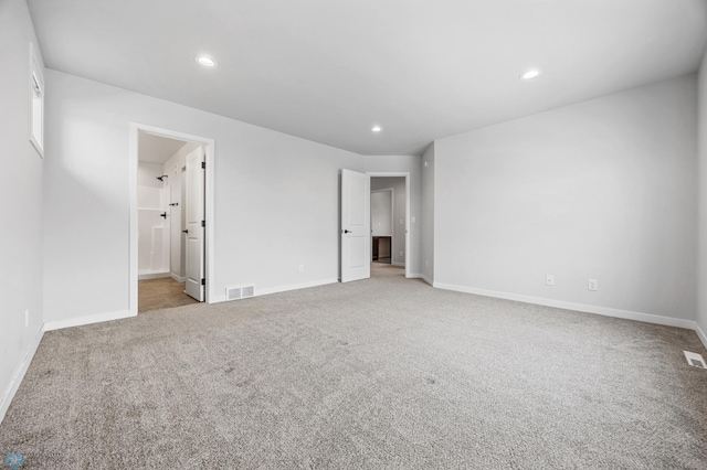 unfurnished room with light carpet