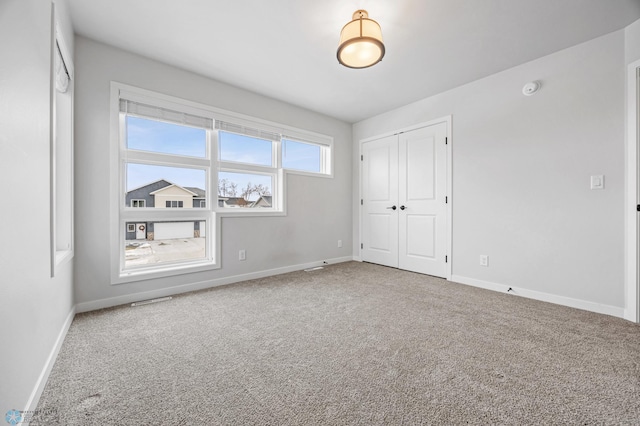 interior space with a closet and carpet floors