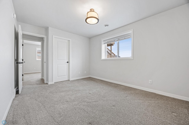 spare room featuring carpet floors