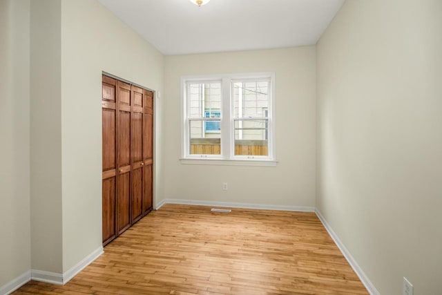 interior space featuring light hardwood / wood-style floors and a closet