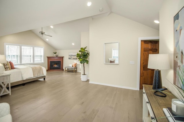 bedroom featuring lofted ceiling and light hardwood / wood-style floors