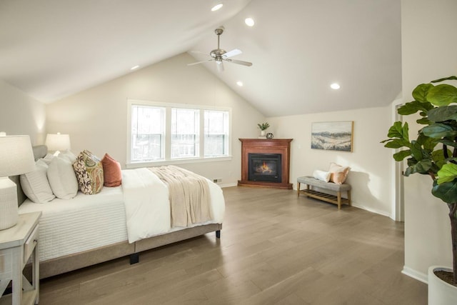 bedroom with lofted ceiling, wood-type flooring, and ceiling fan