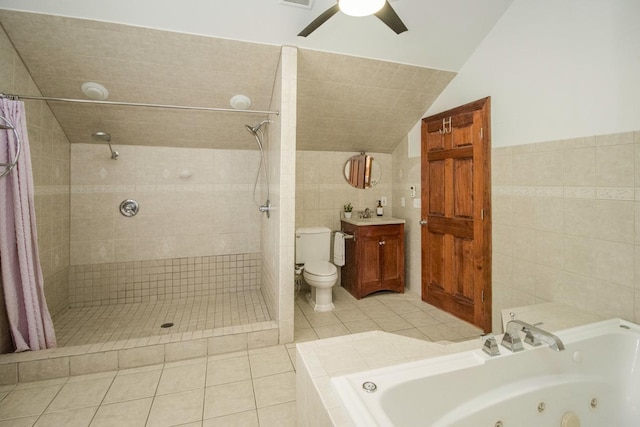 full bathroom featuring vaulted ceiling, separate shower and tub, tile walls, and tile patterned floors