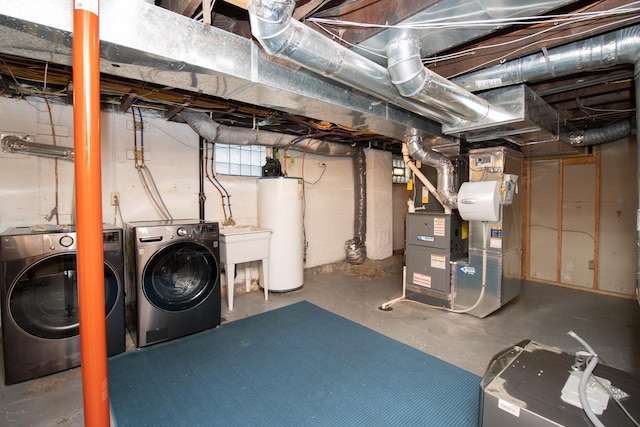 basement with separate washer and dryer, sink, heating unit, and gas water heater