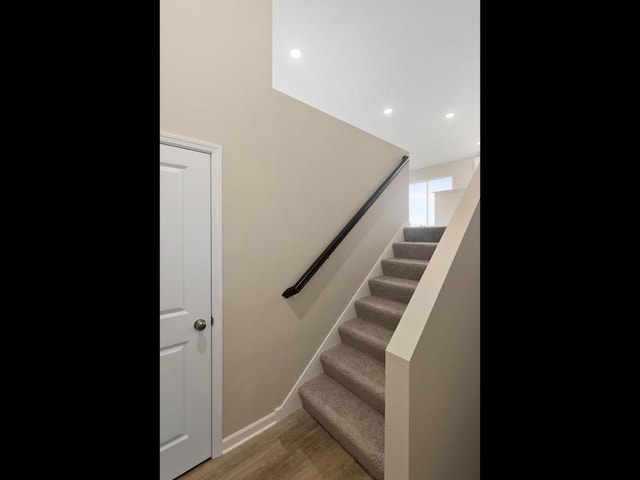 staircase featuring hardwood / wood-style flooring