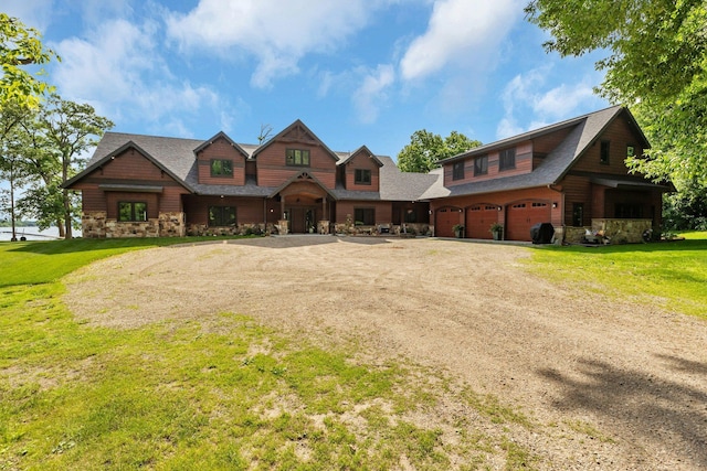 view of front of property with a garage and a front yard