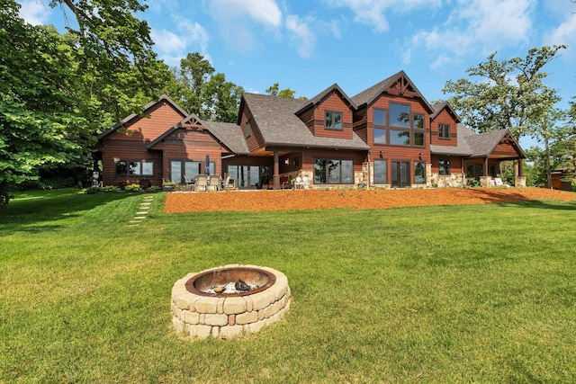 view of front of home featuring a fire pit and a front yard