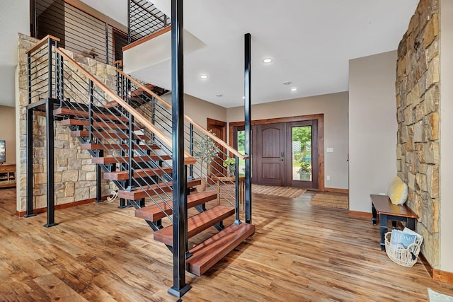 foyer entrance with light hardwood / wood-style floors