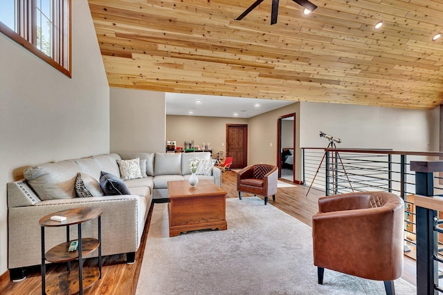 living room with wood ceiling, light hardwood / wood-style flooring, and vaulted ceiling