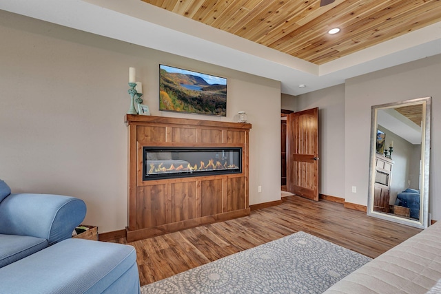 living room featuring wood ceiling and light hardwood / wood-style floors