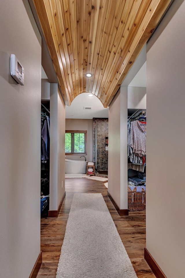 hallway featuring wooden ceiling and wood-type flooring