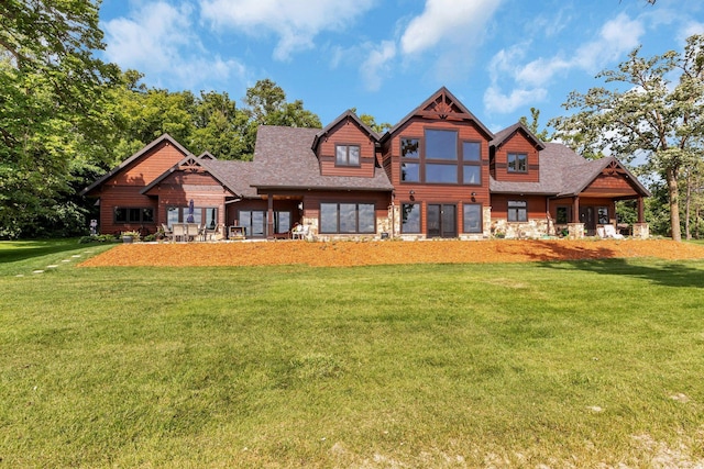 cabin with a front lawn