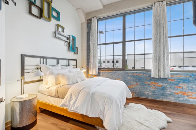 bedroom featuring wood finished floors