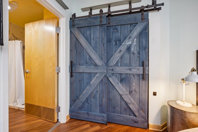 detailed view of a barn door and wood finished floors