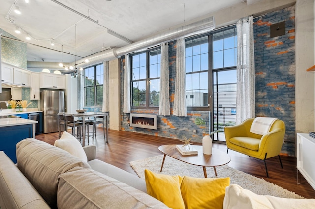 1901 Hennepin Ave Unit 103, Minneapolis, MN 55413 - living area with wood finished floors and rail lighting