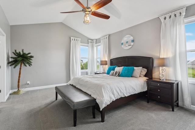 carpeted bedroom with ceiling fan and vaulted ceiling