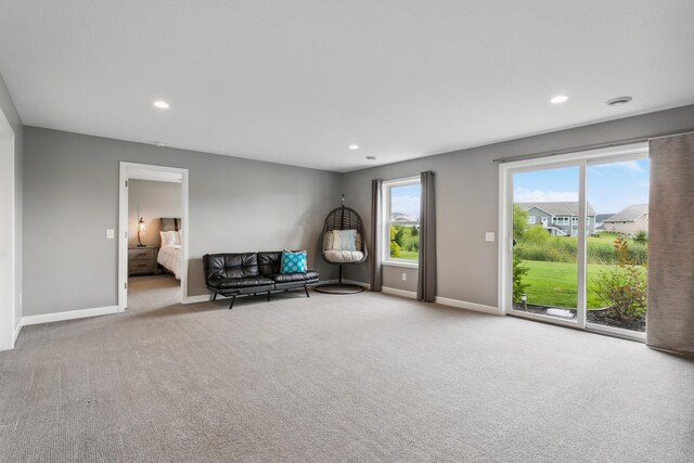 unfurnished room featuring light colored carpet