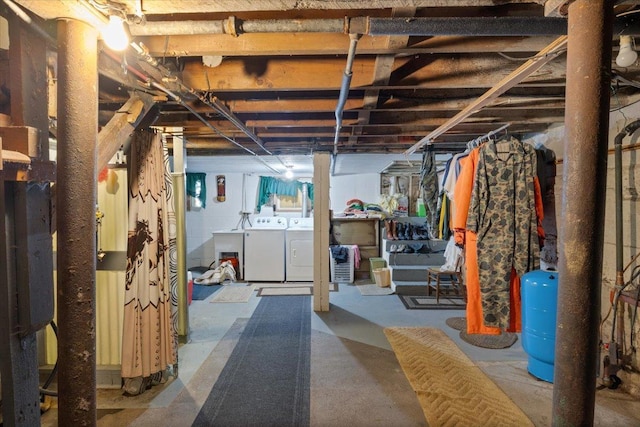 basement featuring washing machine and clothes dryer