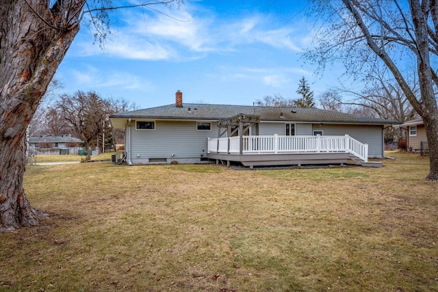 back of house featuring a lawn, central air condition unit, and a deck