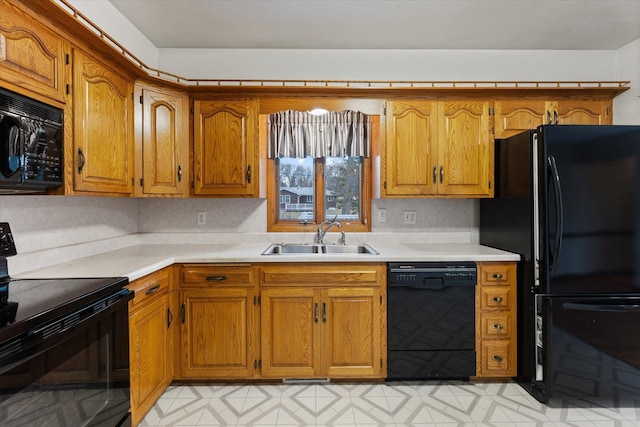 kitchen featuring black appliances and sink