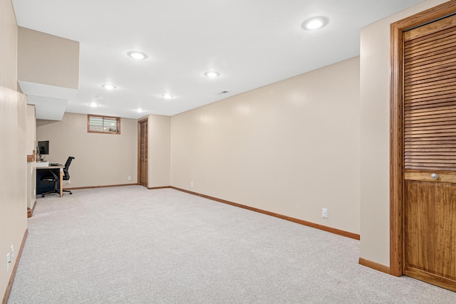 basement with light colored carpet