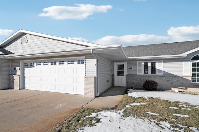 ranch-style house featuring a garage