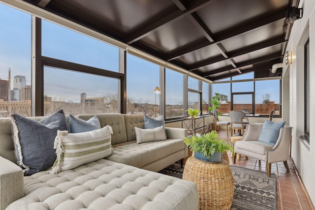 sunroom with a view of city, coffered ceiling, and beamed ceiling