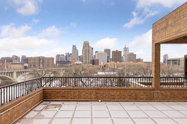 view of patio with a city view and a balcony