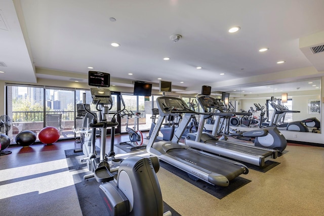 gym featuring a healthy amount of sunlight, visible vents, and recessed lighting