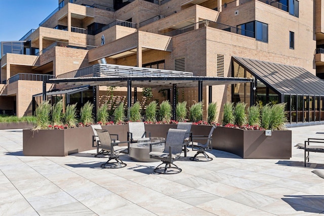 view of patio with an outdoor fire pit