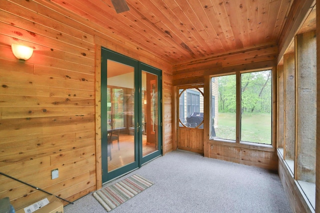 sunroom with a healthy amount of sunlight and wood ceiling