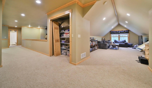 interior space with light colored carpet and lofted ceiling