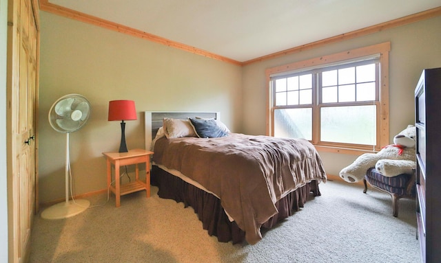 carpeted bedroom featuring ornamental molding