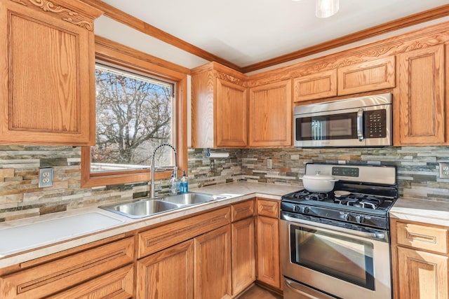 kitchen with sink, stainless steel appliances, and tasteful backsplash